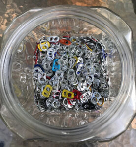 Zip lock baggie fill with aluminum can pop tops.